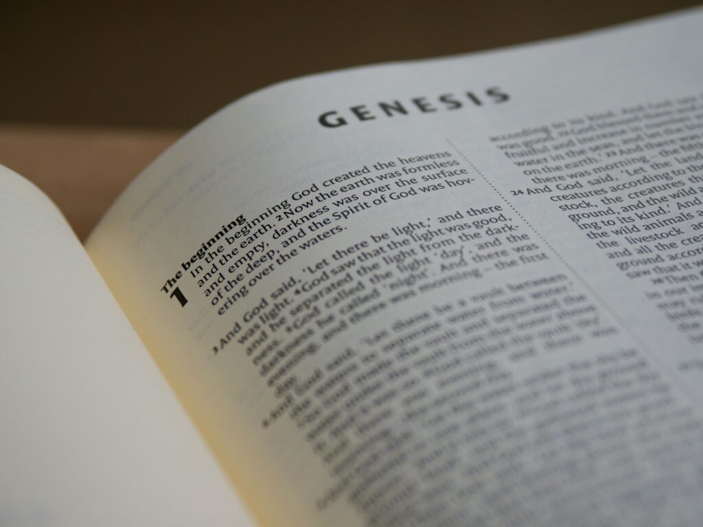 pexels-photo-4654082-4654082 Detailed view of the Book of Genesis in a Bible with selective focus accentuating the text.